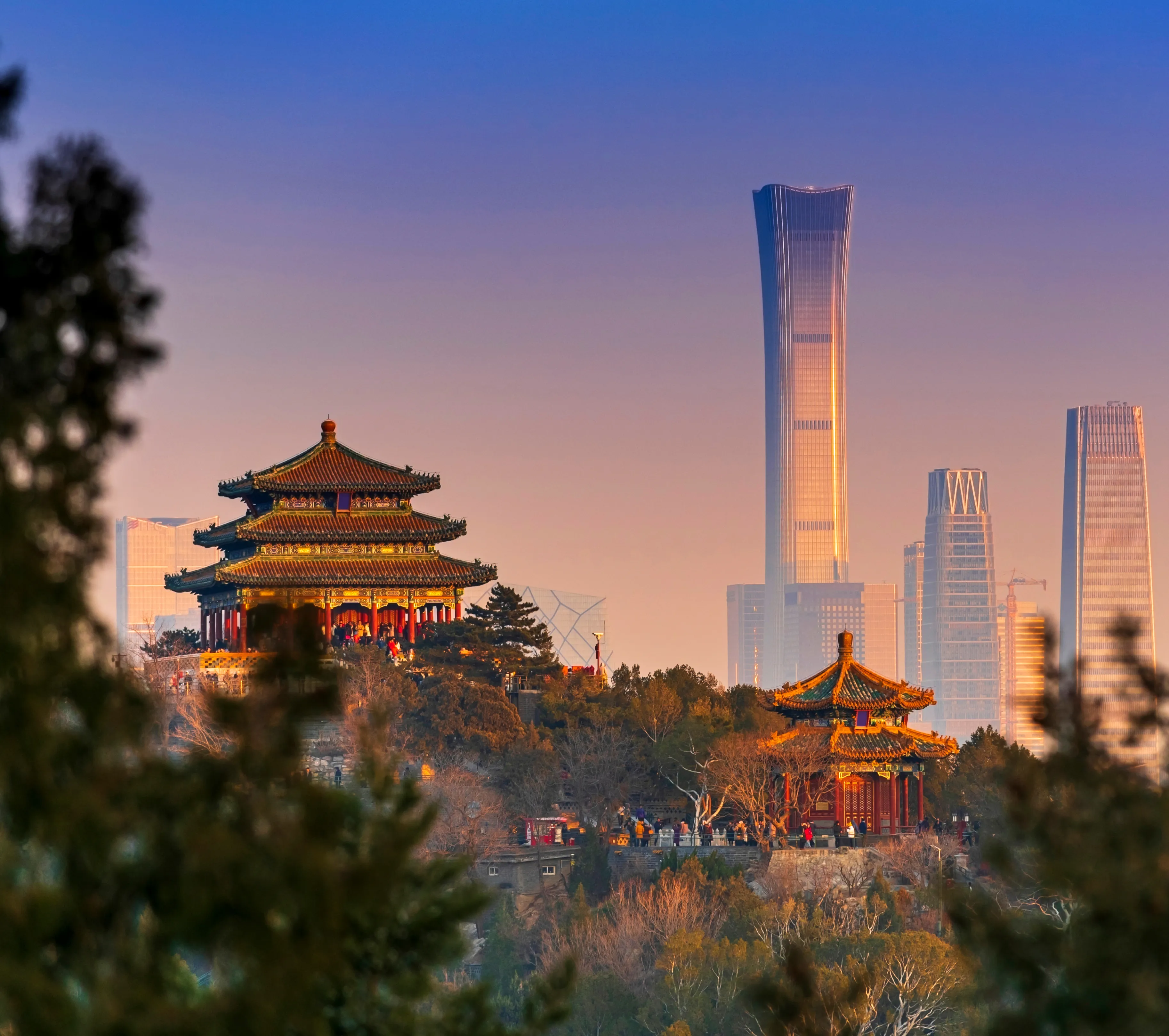 View of Beijing, China with ancient Chinese architecture in foreground and Central Business District in background