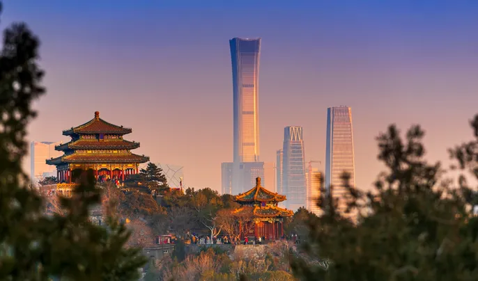 View of Beijing, China with ancient Chinese architecture in foreground and Central Business District in background