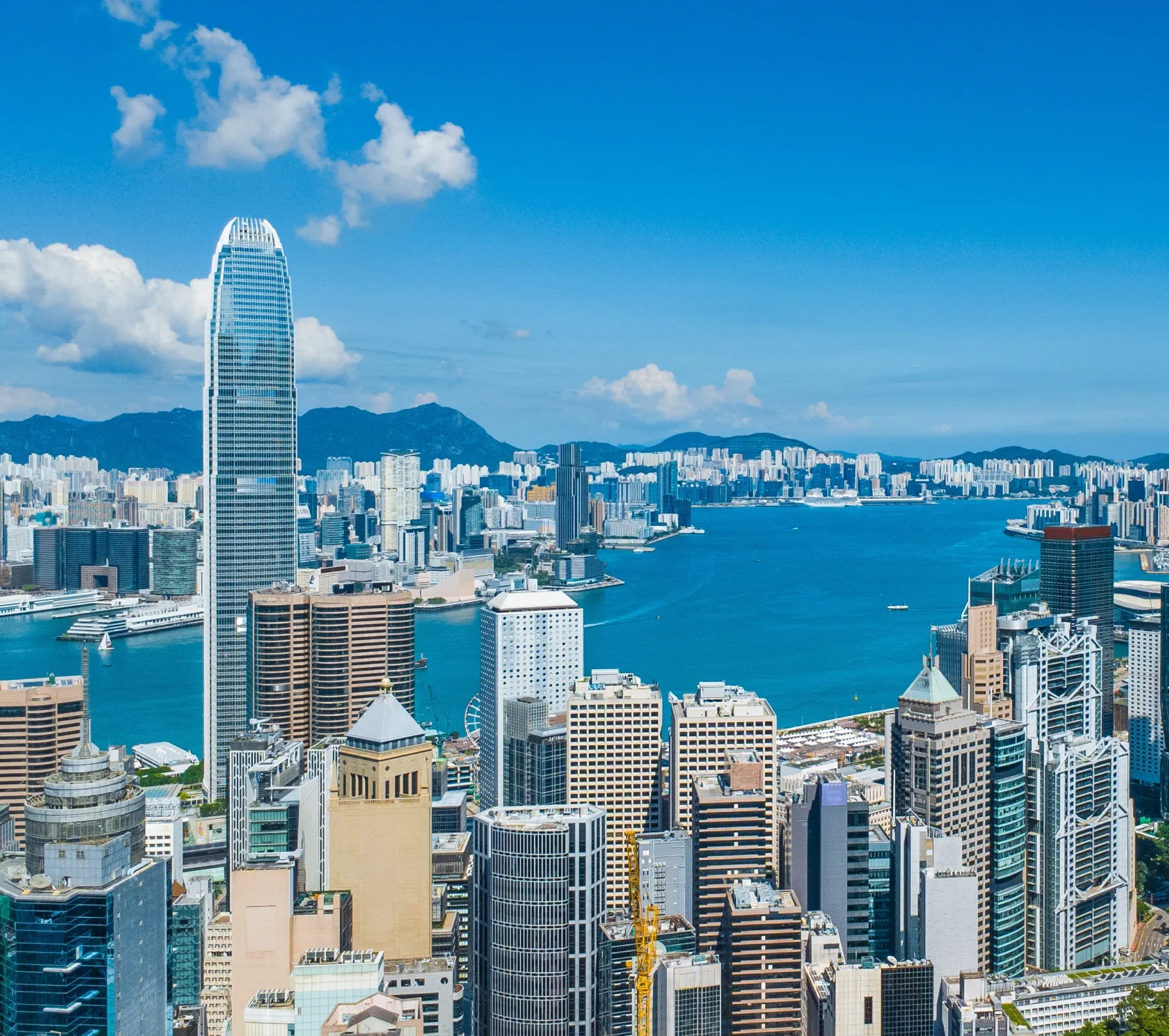 Aerial view of Hong Kong business skyscrapers, Victoria Harbour, Kowloon and Hong Kong Island.